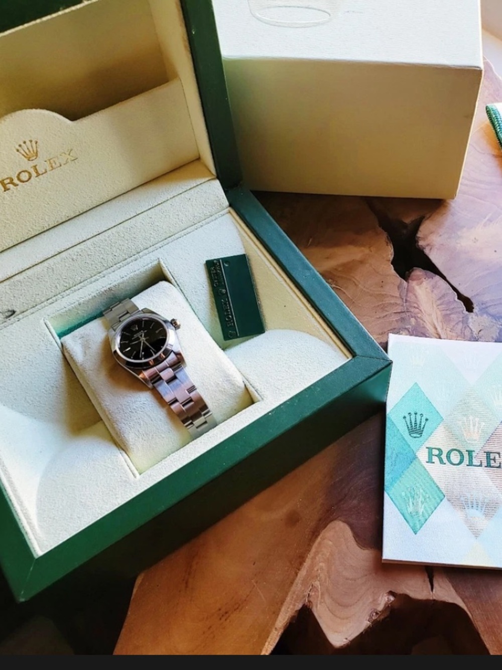 Rolex Ladies Stainless Steel Watch with Black Dial and Silver Accents